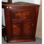 A fruit wood corner cupboard with figured elm panels