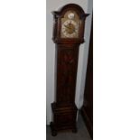 An oak cased grandmother clock with brass dial