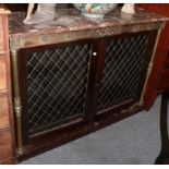 A Regency mahogany and brass inlaid two door cabinet, the rouge marble top above an inlaid frieze