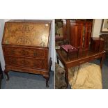 A early 20th century oak two drawer writing table in mahogany collectors cabinet with twelve