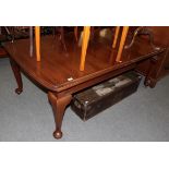 A Victorian mahogany wind-out dining table with two small additional leaves