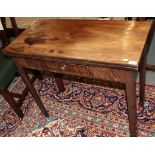 A George III mahogany fold over tea table