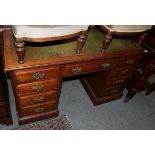 A late Victorian walnut twin pedestal desk