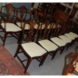 A set of twelve reproduction Hepplewhite style dining chairs