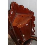 A Victorian pine hanging corner cupboard and a mahogany butler's tray with stand