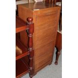 Early 20th century oak tambour front cabinet with key