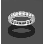A Diamond Eternity Ring, twenty-four round brilliant cut diamonds in white rubbed over settings,