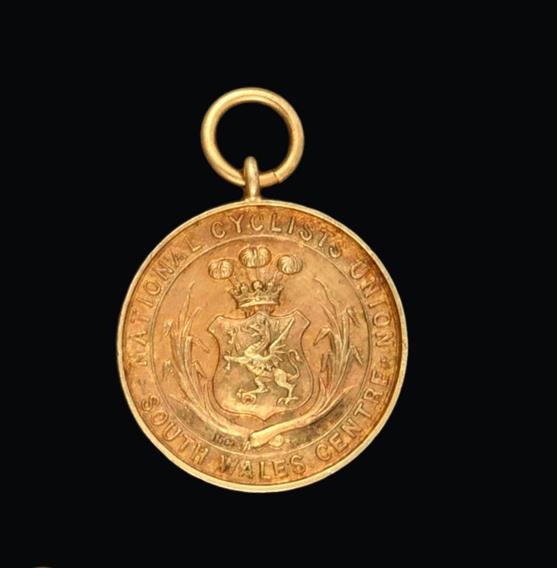 A Victorian Gold Medal, Stamped '15ct', Dated 1897, circular the obverse with a shield chased with