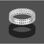 A Platinum Diamond Eternity Ring, formed of two rows of round brilliant cut diamonds in claw