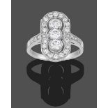 An Art Deco Style Diamond Plaque Ring, three round brilliant cut diamonds within a pierced border of