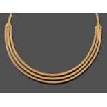 A Fancy Brick Link Necklace, formed of yellow brick links with graduated three row detail to the