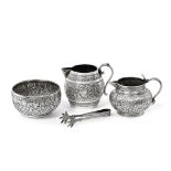 Two Indian Silver Cream-Jugs and a Sugar-Bowl, Apparently Unmarked, Late 19th Century, the cream-