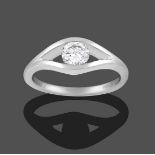 A Platinum Diamond Solitaire Ring, the round brilliant cut diamond tension set within a lozenge