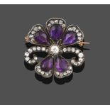 An Edwardian Amethyst and Diamond Brooch/Pendant, in the form of a flower, an old cut diamond