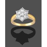 An 18 Carat Gold Diamond Cluster Ring, seven round brilliant cut diamonds, in white claw settings,