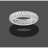 A Diamond Bombé Eternity Ring, three rows of round brilliant cut diamonds in white claw settings,