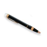 A Montblanc Starwalker Roller-Pen, Numbered MBNC40HPO, the black resin body with gilt mounts, the
