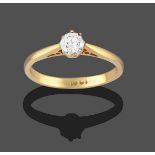 A Diamond Solitaire Ring, the round brilliant cut diamond in a yellow claw setting, to a tapered