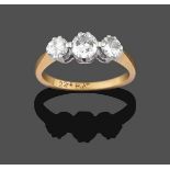 A Diamond Three Stone Ring, the graduated round brilliant cut diamonds in white double claw
