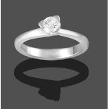 A Platinum Diamond Solitaire Ring, the round brilliant cut diamond in a three claw setting, to