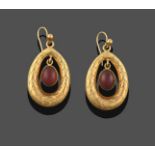 A Pair of 9 Carat Gold Garnet Drop Earrings, the oval cabochon garnet in a yellow rubbed over