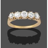 A Diamond Five Stone Ring, the old cut diamonds in yellow claw settings, to a tapered shoulder plain
