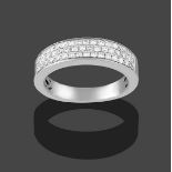 An 18 Carat White Gold Diamond Half Hoop Ring, three rows of eight-cut diamonds in claw settings, to