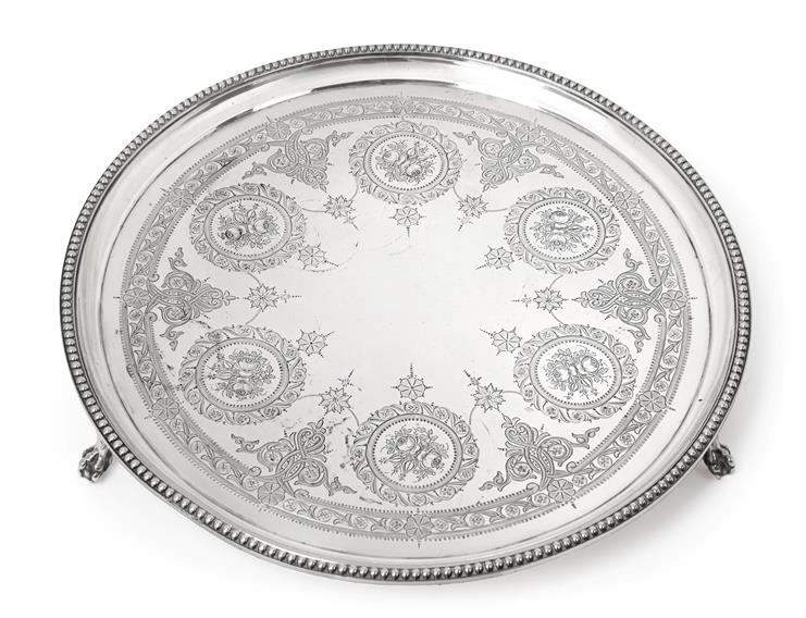 A Victorian Silver Salver, by Edward Ker Reid, London, 1871, circular and on three ball and claw