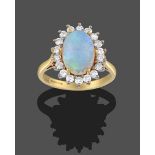 An 18 Carat Gold Opal and Diamond Cluster Ring, the oval cabochon opal in yellow claw settings,