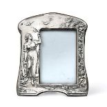 An Edward VII Silver Photograph-Frame, by Henry Matthews, Birmingham, 1905, shaped oblong, one