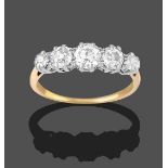 A Diamond Five Stone Ring, the graduated old cut diamonds in white claw settings, to a yellow