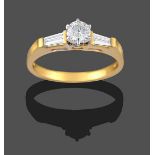 An 18 Carat Gold Diamond Solitaire Ring, the round brilliant cut diamond in a white claw setting, to