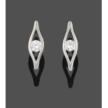 A Pair of Platinum Diamond Solitaire Earrings, the round brilliant cut diamond tension set within