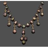 An Edwardian Black Mother-of-Pearl Fringe Necklace, fifteen circular black mother-of-pearl suspend
