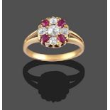 A Ruby and Diamond Cluster Ring, the old cut diamond within a border of old cut diamonds and cushion