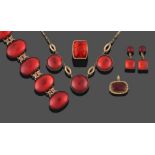 A Red Chinese Amber Necklace, formed of three round cabochon red ambers in yellow rubbed over