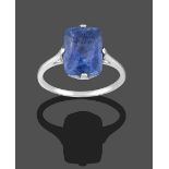 A Sapphire Ring, the cushion cut sapphire in a white four claw setting, to a tapered shoulder