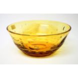 Whitefriars - William Wilson: A Cut Glass Bowl, in gold amber, decorated with comets, designed in