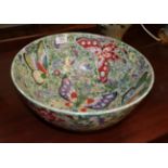 A late 19th century Japanese bowl decorated with butterflies and flowers, 36cm diameter