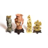 Three Chinese soapstone carvings, the largest of a twin handled vase decorated with flower swags and