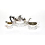 A three-piece Victorian silver tea service, by John Henry Potter, Sheffield, 1895, each piece part