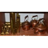 A 19th century cast two door stops, three copper kettles, pair of andirons, two weather vain mounts,