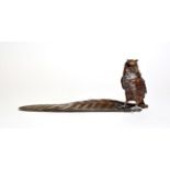 An Austrian cold-painted bronze inkwell, owl standing on a feather, stamped, 13.5cm high by 34.5cm