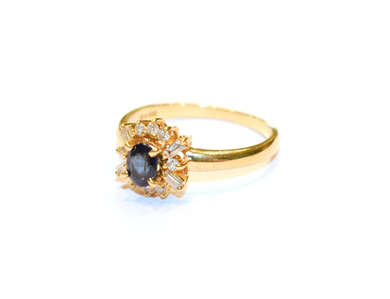 An 18 carat gold sapphire and diamond cluster ring, the oval cut sapphire within a border of round