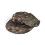 A copy of a German Third Reich SS camouflage field cap, of herringbone twill, the exterior with 'pea
