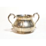 A Victorian silver sugar bowl, by Robert Hennell, London, 1865, lobed circular and on collet foot,