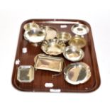 A collection of assorted silver dishes and ashtrays, variously shaped, one with overhead swing