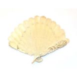 A carved ivory fan, circa 1900, each section carved at the tip as a feather, the ends carved with