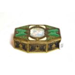 An Art Deco silvered and enamel box, oblong shape, chased with flower and foliage and set with green