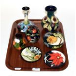 Seven pieces of modern Moorcroft pottery including vases, ginger jar and cover, powder bowl and